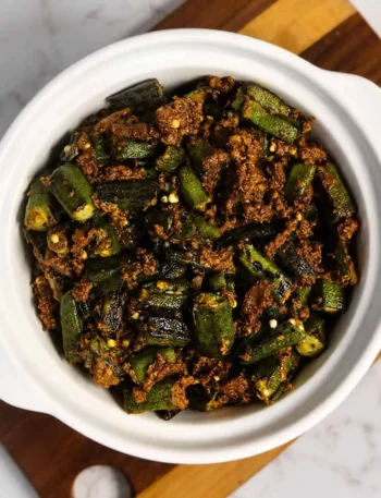 Bhindi okra cooked in stuffed vegetable masala served with paratha