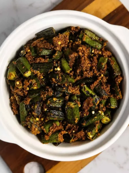 Bhindi okra cooked in stuffed vegetable masala served with paratha